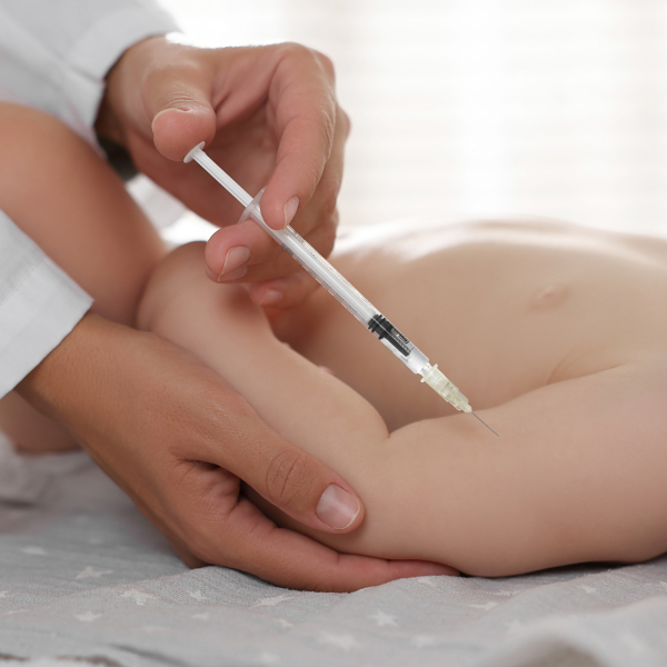 pediatrician-giving-injection-baby-clinic-closeup